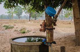 A well surrounded by dry desert